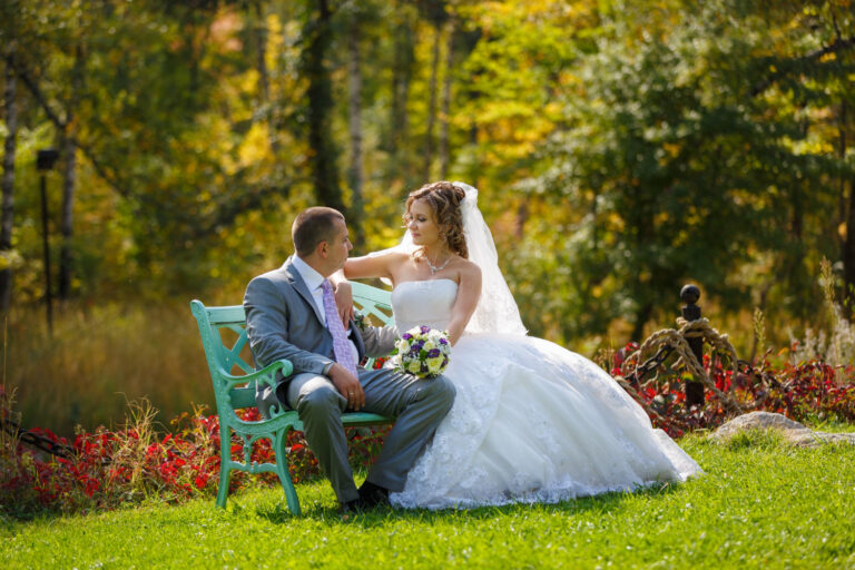 Photo of couple sitting on parker bench